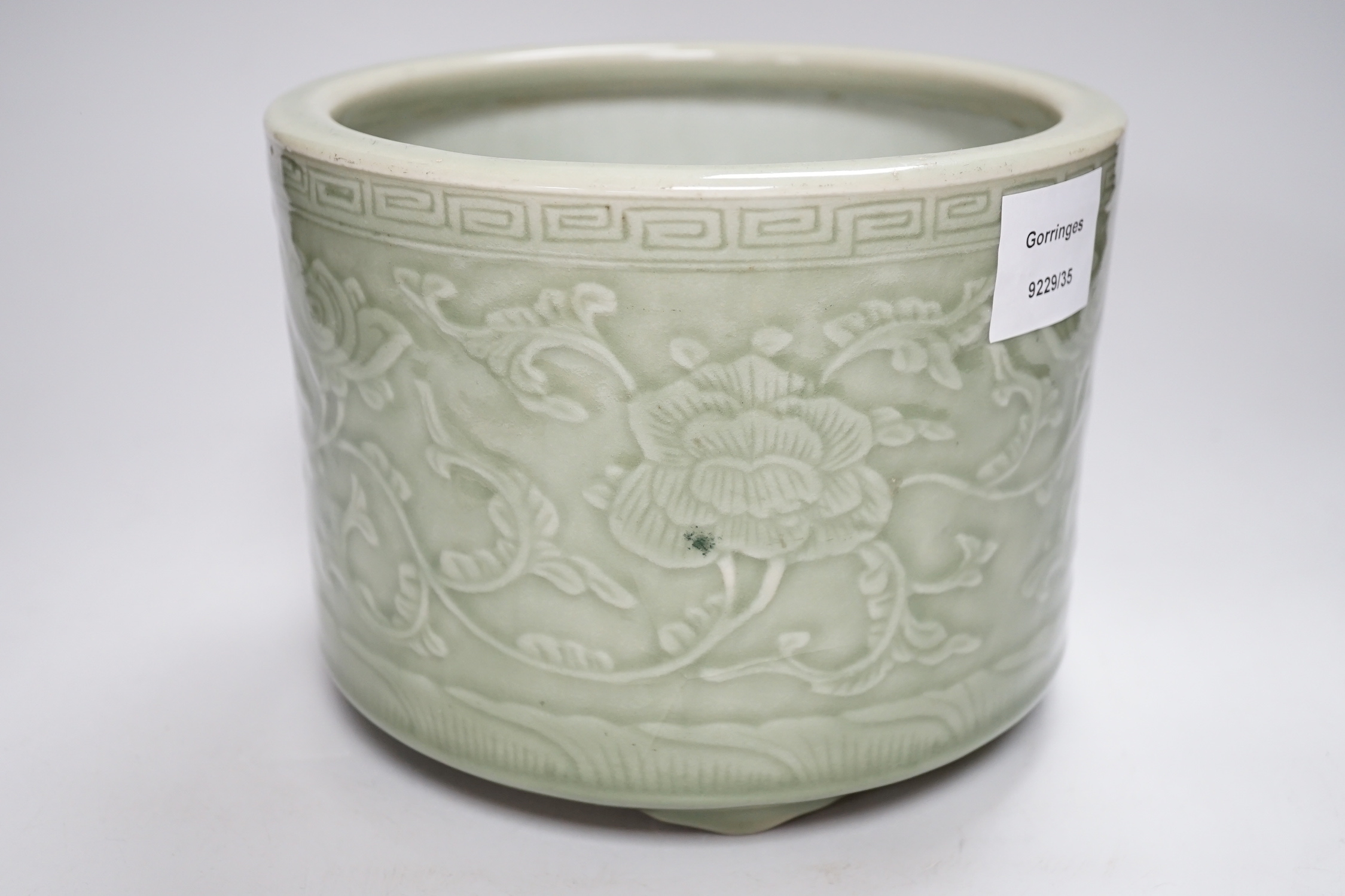 A Chinese celadon glazed tripod brushpot, 19th century